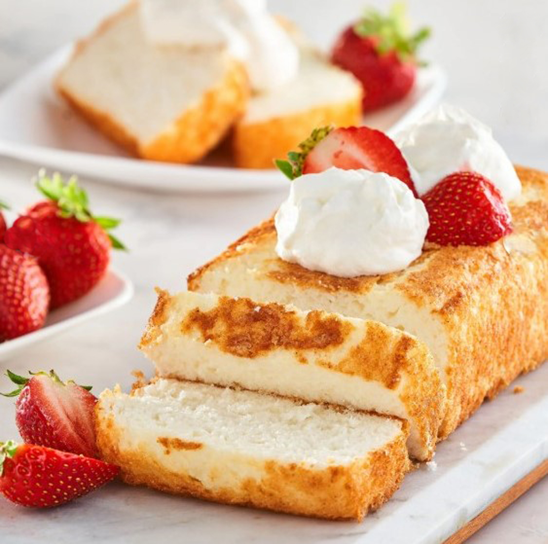Benson's angel food cake sliced and topped with strawberries